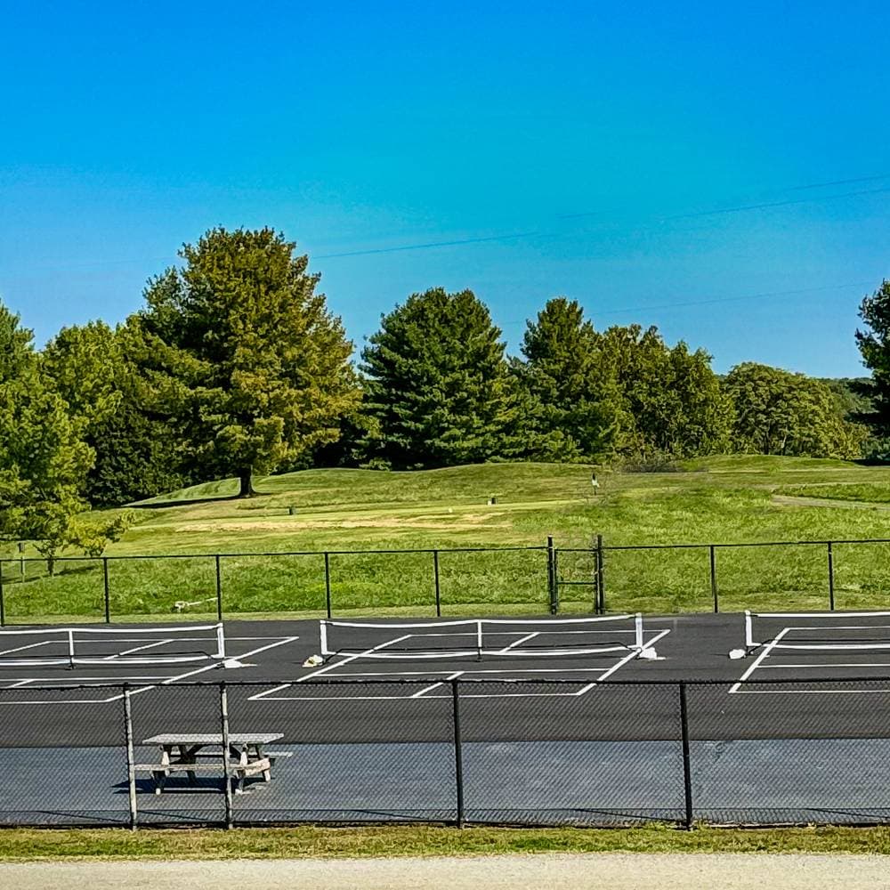 Three freshly painted pickleball courts at The Greene Hills Club, ready for the season.